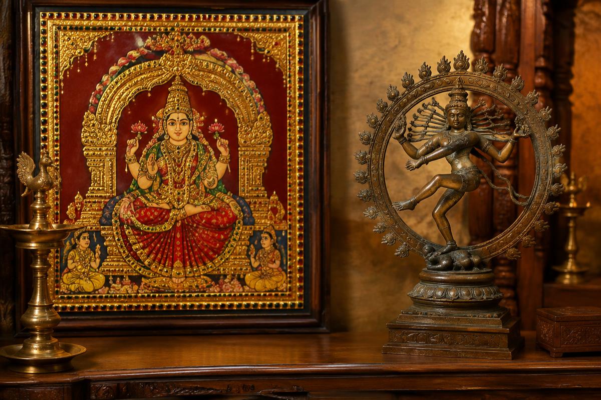 Tanjore painting beside a Chola bronze sculpture